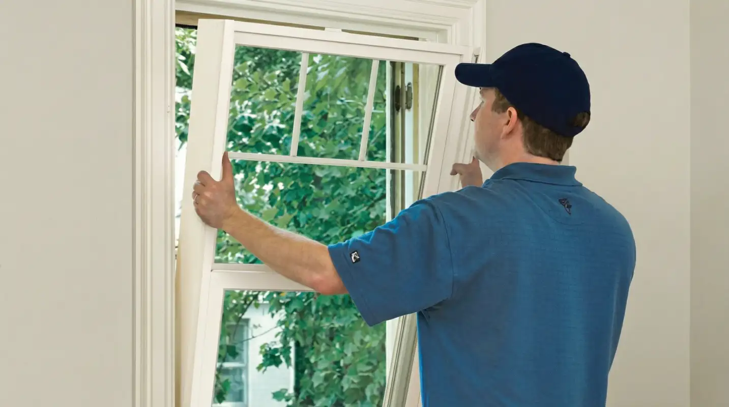 Professional contractors performing a residential window insulation and replacement service in Baton Rouge, LA